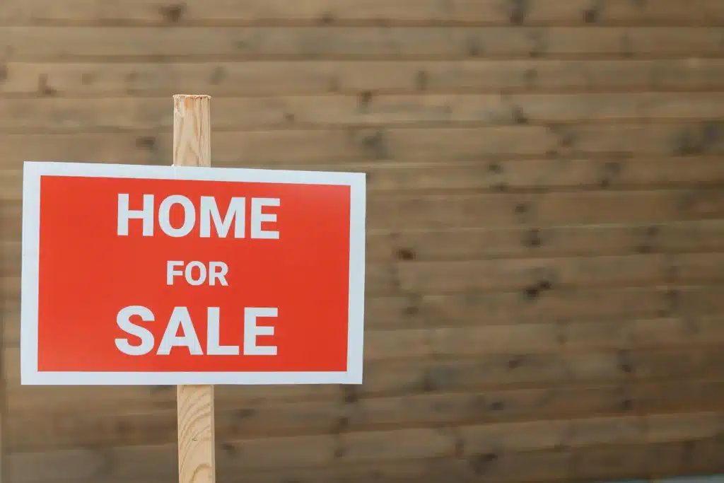 red home for sale sign
